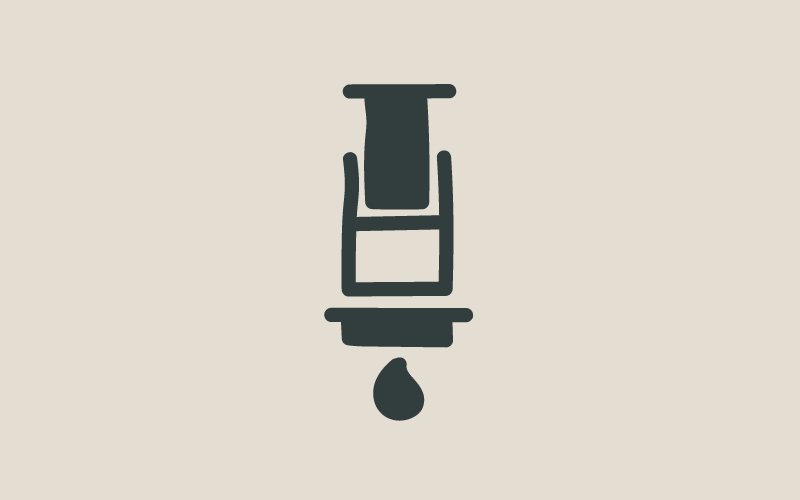 A cartoon image of an aeropress with a drip coming out of it