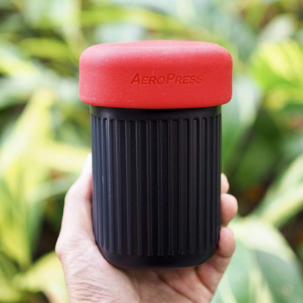 An aeropress go travel coffee maker compacted down into its travel size.