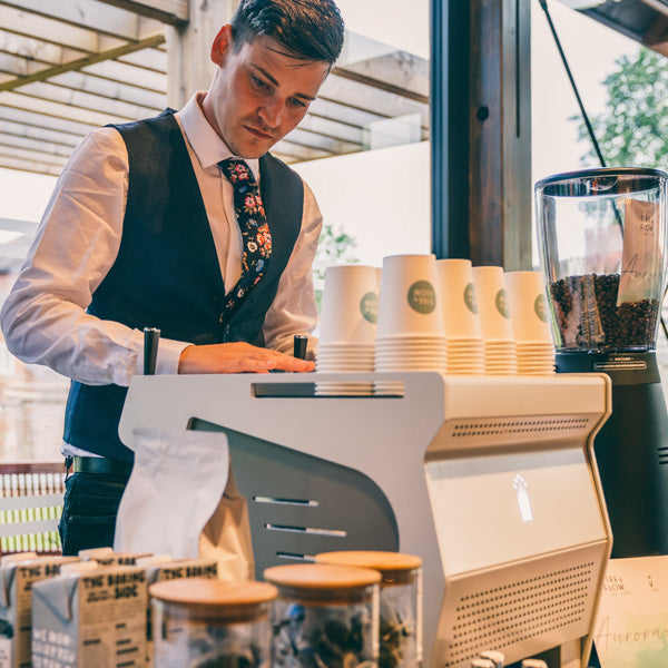 Callum, one of the founders of Decaf Coffee Club using a Conti Ace Espresso Machine